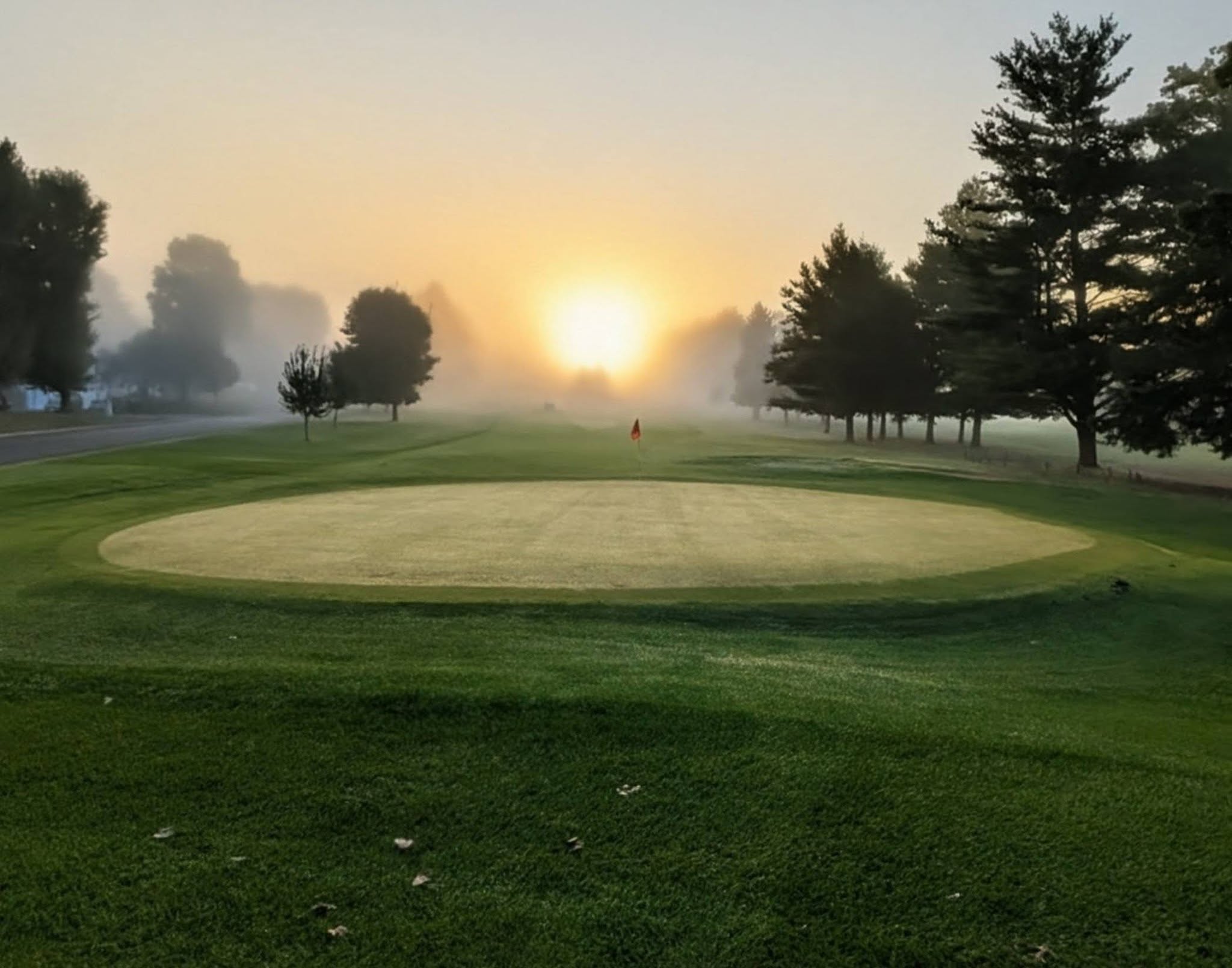 Sunrise over the golf course green
